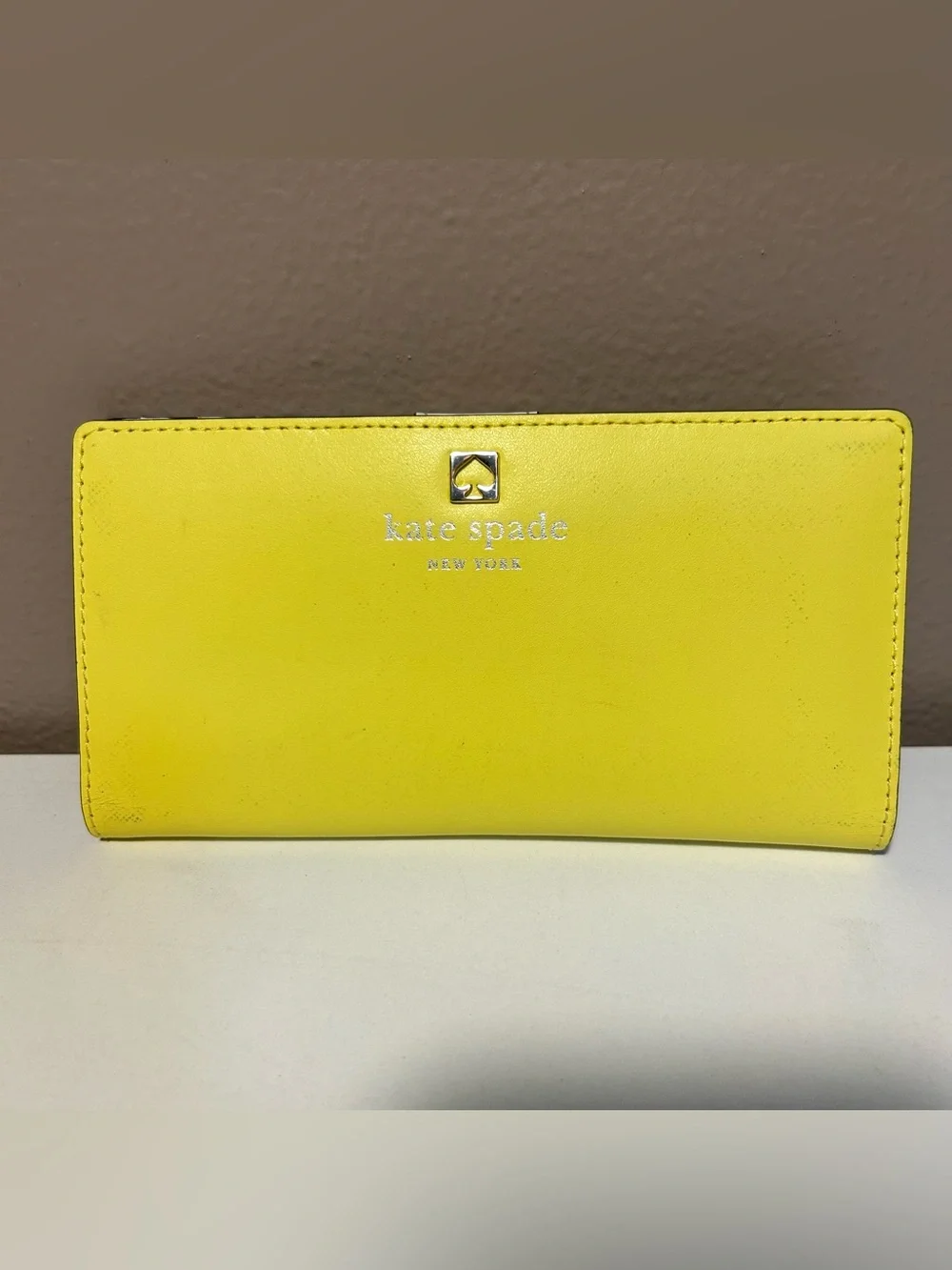 kate spade Yellow Leather Slim Bifold Wallet